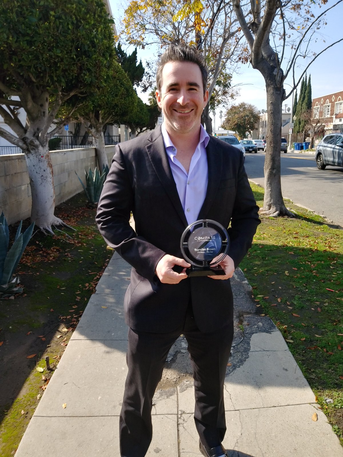 Brendan holding his Consulting Award for Production